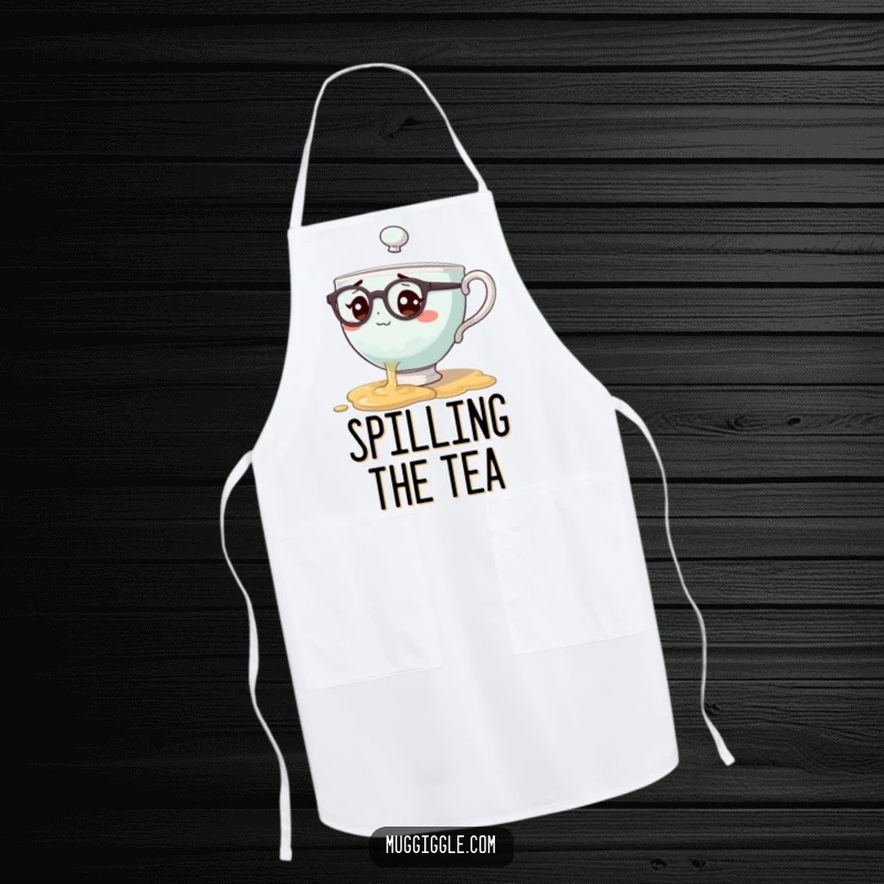 Funny apron with a teacup character wearing spectacles spilling tea, designed for kitchen use with endearing, clumsy humor.
