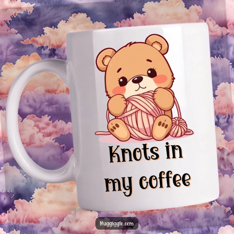 Funny mug showcasing a bewildered brown bear completely tangled in a massive ball of colorful yarn, looking hilariously confused.