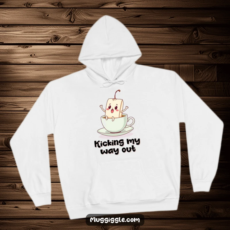 Funny hoodie with a startled teabag showing off its kicking legs, making a break for it from a teacup, a comedic print.