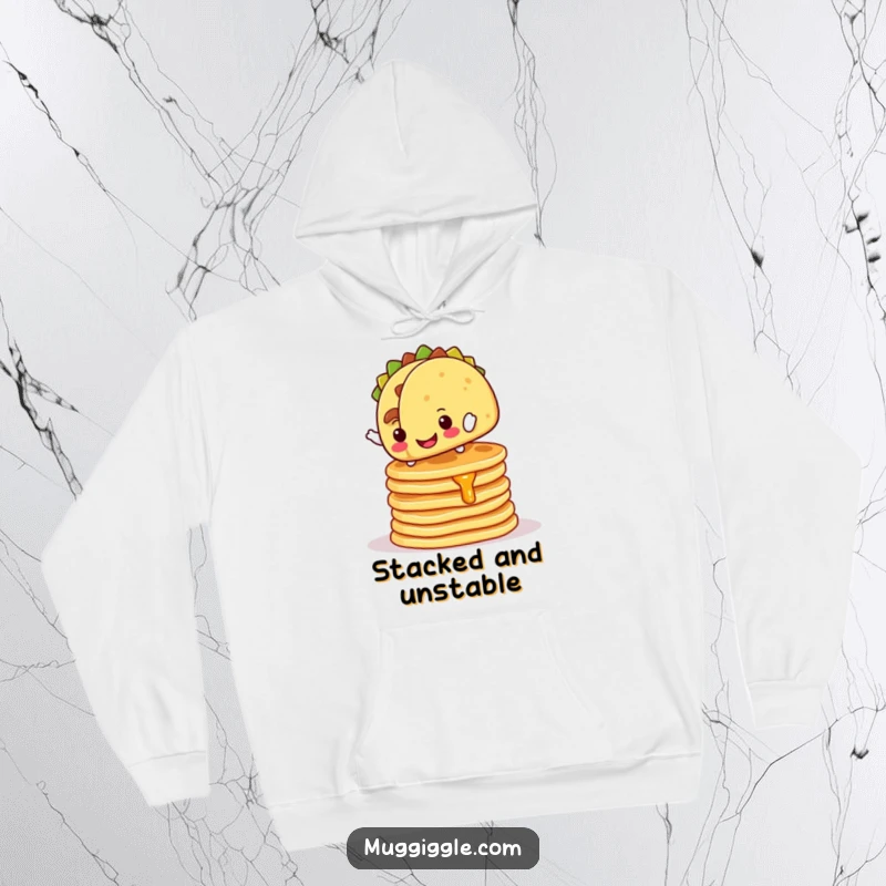 Funny Hoodie: Cheerful taco character balancing precariously on pancakes, a warm and humorous clothing item.